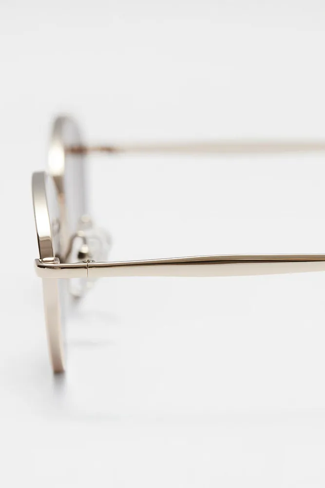 Овальные солнцезащитные очки в металлической оправе & OTHER STORIES